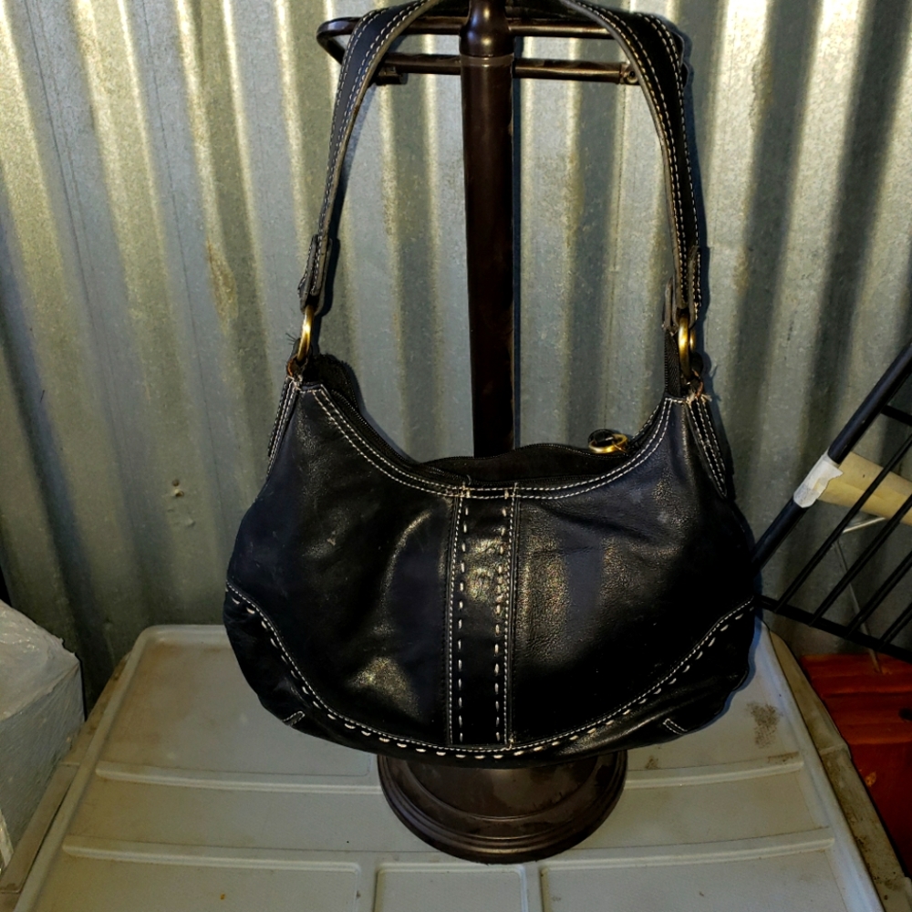 Black leather bag with white stitching